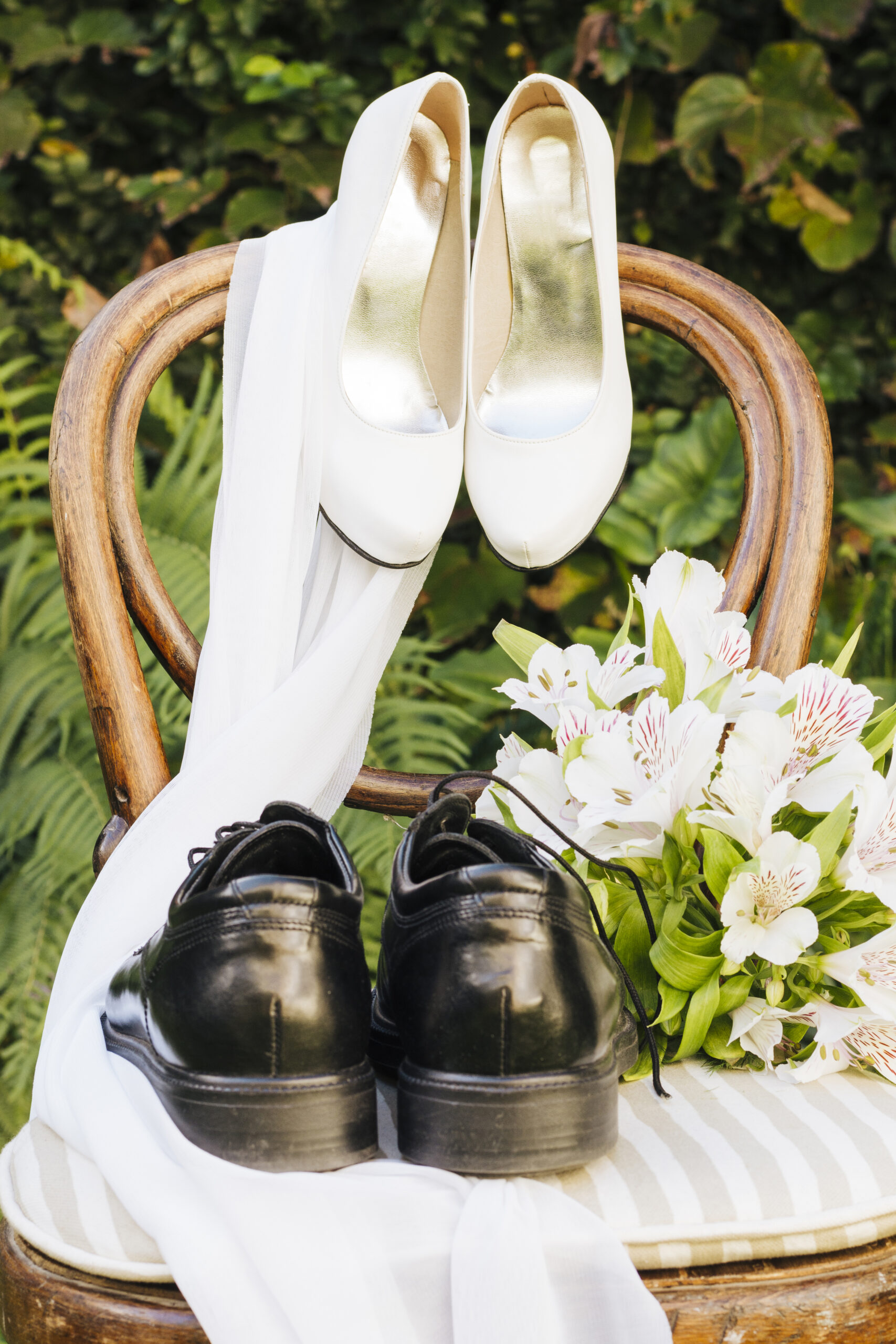 wedding shoes scarf flower bouquet wooden chair scaled